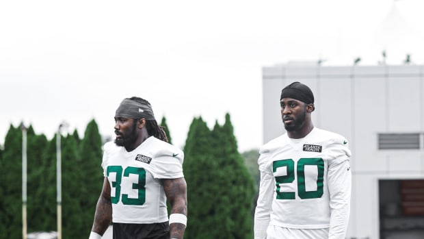 Jets' running backs Dalvin Cook (33) and Breece Hall (20) in Florham Park